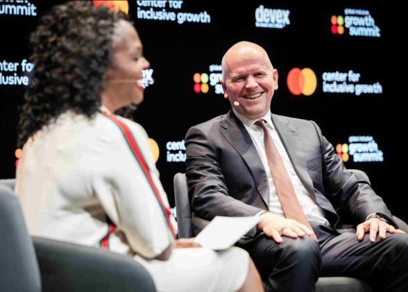 Alissa &quot;Dr. Jay&quot; Abdullah, left, Mastercard&#039;s deputy chief security officer, chats with Mastercard CEO Michael Miebach, right, and Valdecy Urquiza, secretary general of INTERPOL, not pictured, about growing cybersecurity threats. 