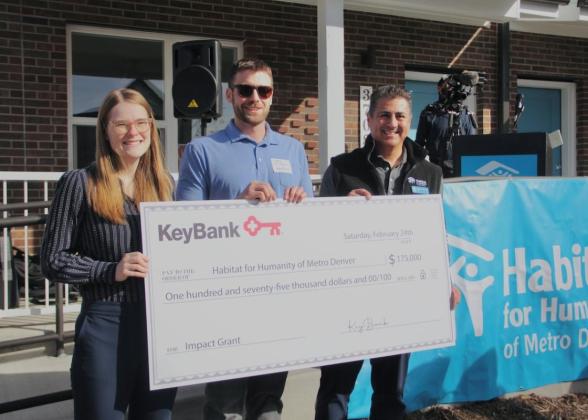 Team members from Habitat for Humanity shown with a $175,000 grant check from KeyBank.