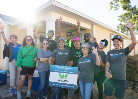 Team Wesco shown in front of the house that they worked on during the ream build.