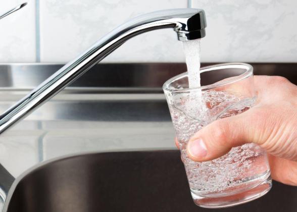 Getting a glass of water from the kitchen sink