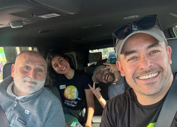 Mike Bean in a van with other volunteers