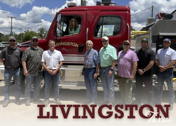 Group from the Livingston fire department standing by fire truck