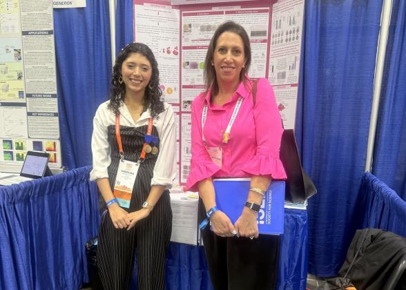 Kristin Dasaro, Director, Package Engineering and Sustainability at Mary Kay, greets Brazilian cancer researcher, Carolina de Araujo Pereira da Silva, who received back-to-back awards from Mary Kay for innovative findings in the malignancy of tumors. (Photo Credit: Mary Kay Inc.)
