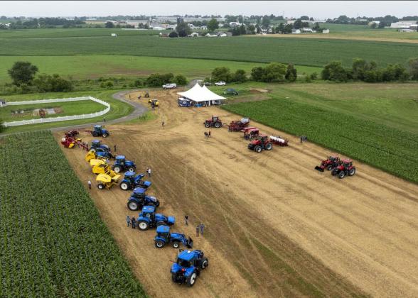 Aerial view of tractors and a tent