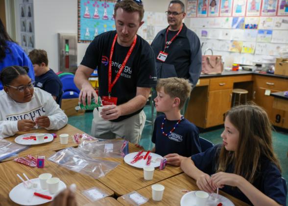 teachers working with students in a classroom