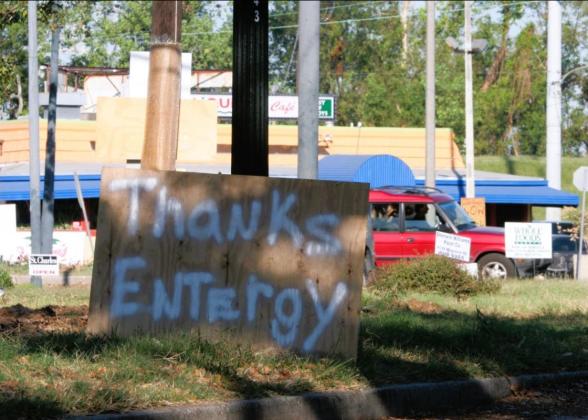 A spray-painted piece of plywood that says &quot;Thanks Entergy&quot;