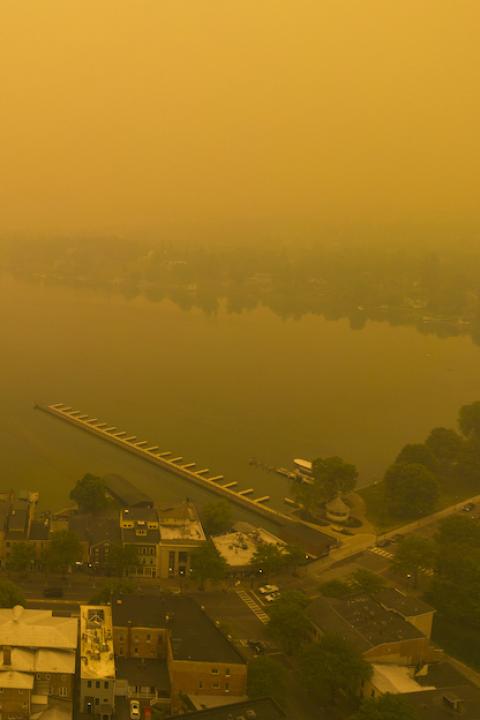 Air pollution from wildfires in Canada cover New York with an orange haze.