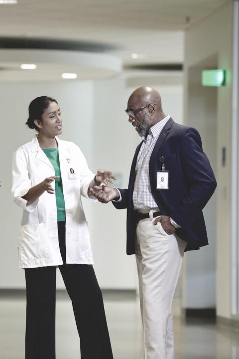 Doctors talking in a hospital - ensuring diversity in clinical trials