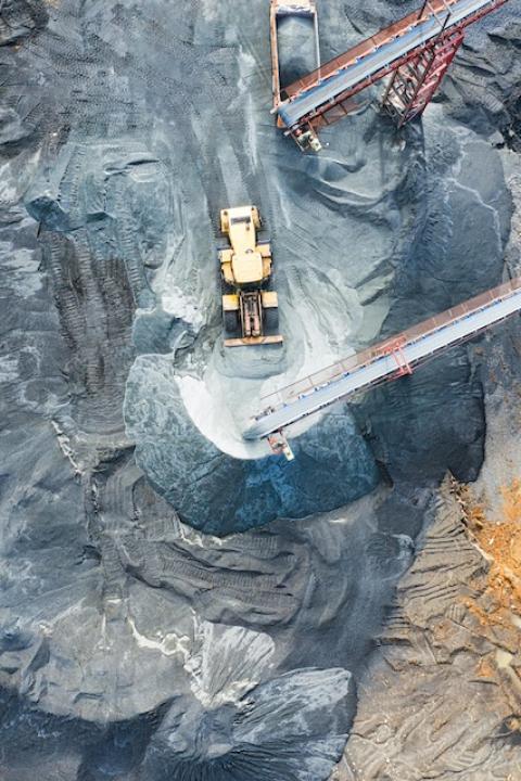 Aerial view of heavy machinery at a mine. 