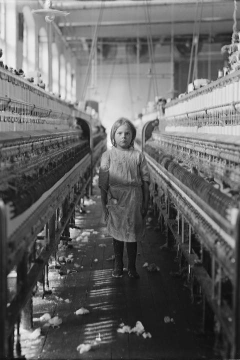 child labor in the early 20th century - little girl working in a mill