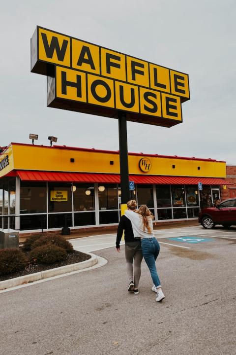 couple going into waffle house 