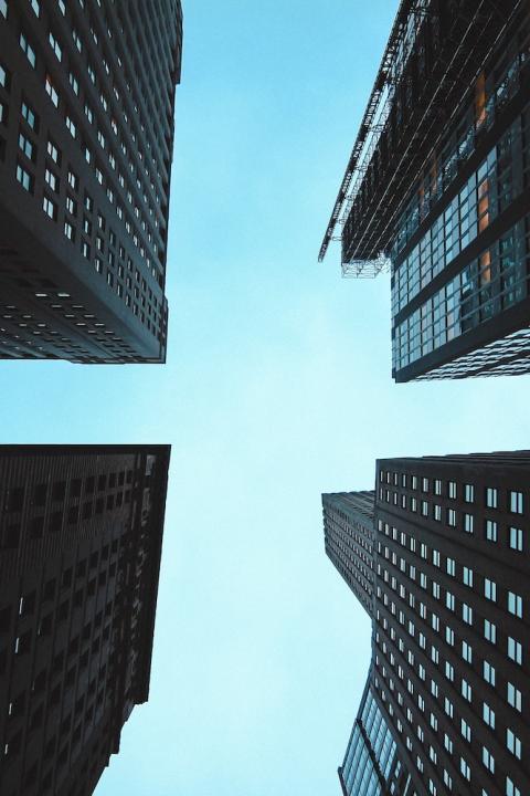 looking up at high rises in the city - ESG matters even during economic downturns