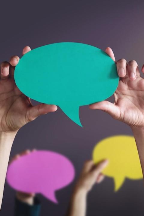 people holding up conversation bubbles - what Americans have to say about ESG