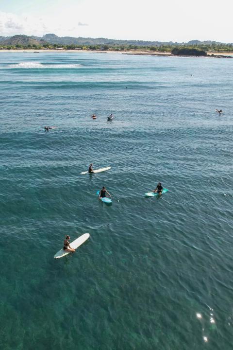 surfers in the water in bali