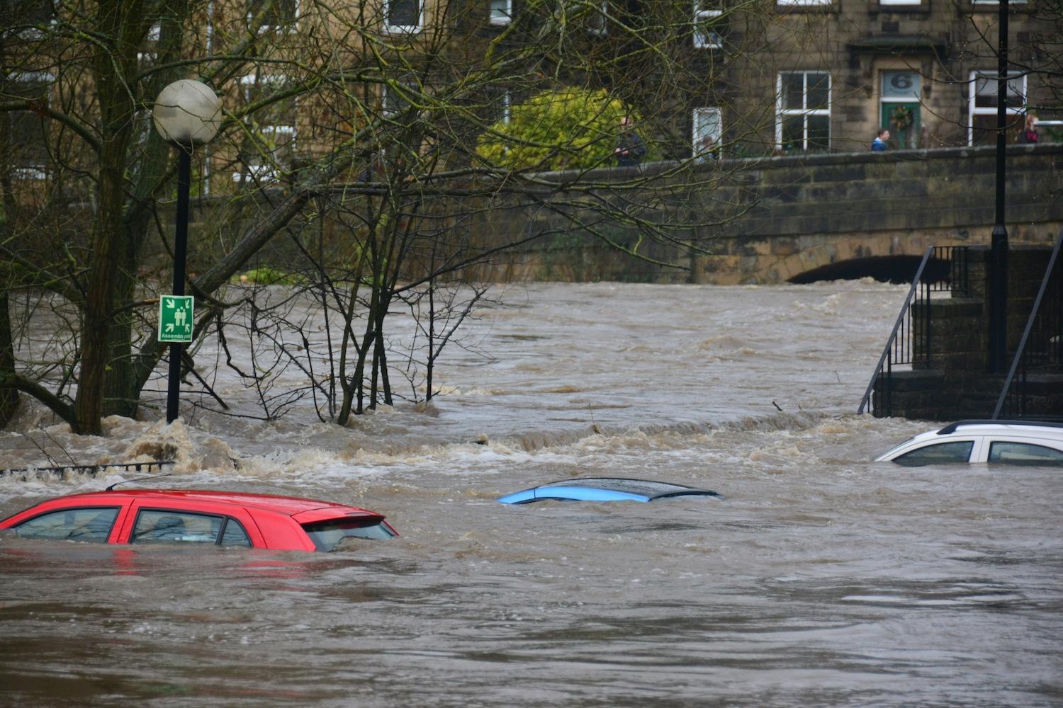 Cars on a flooded street. 
