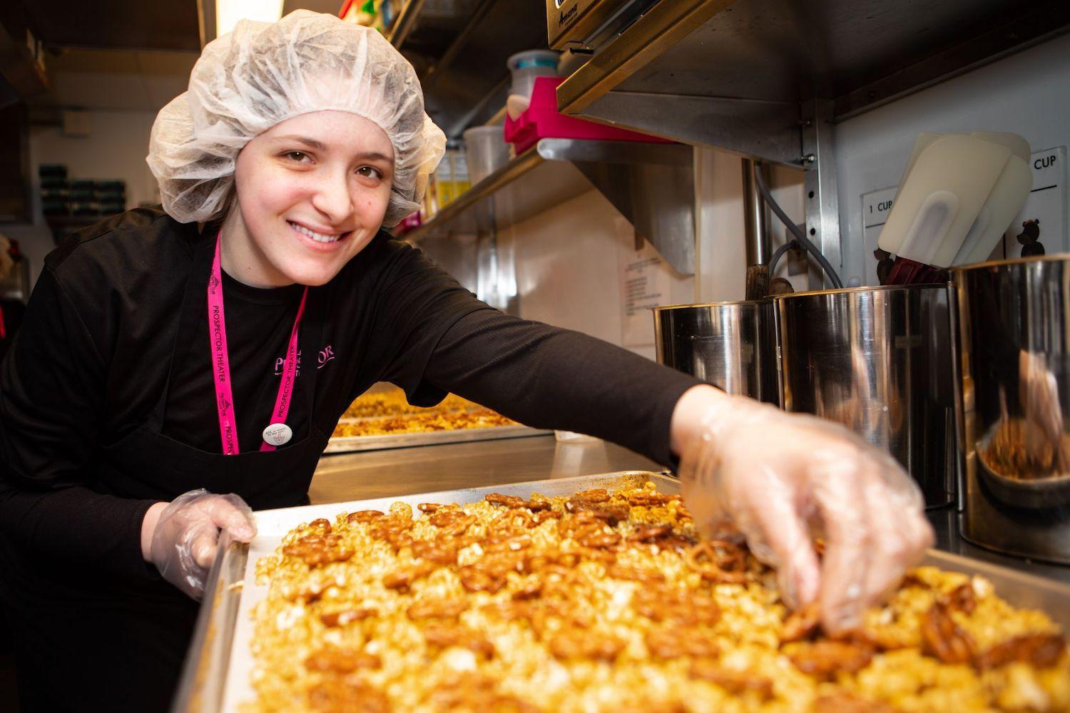 A Prospector Popcorn employee makes one of their gourmet popcorn recipes. 