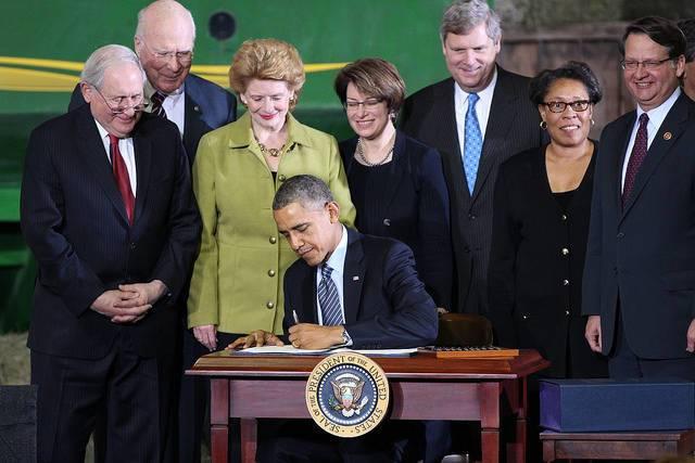 President-Obama-signing-the-Farm-Bill-into-law-in-2014.jpg 