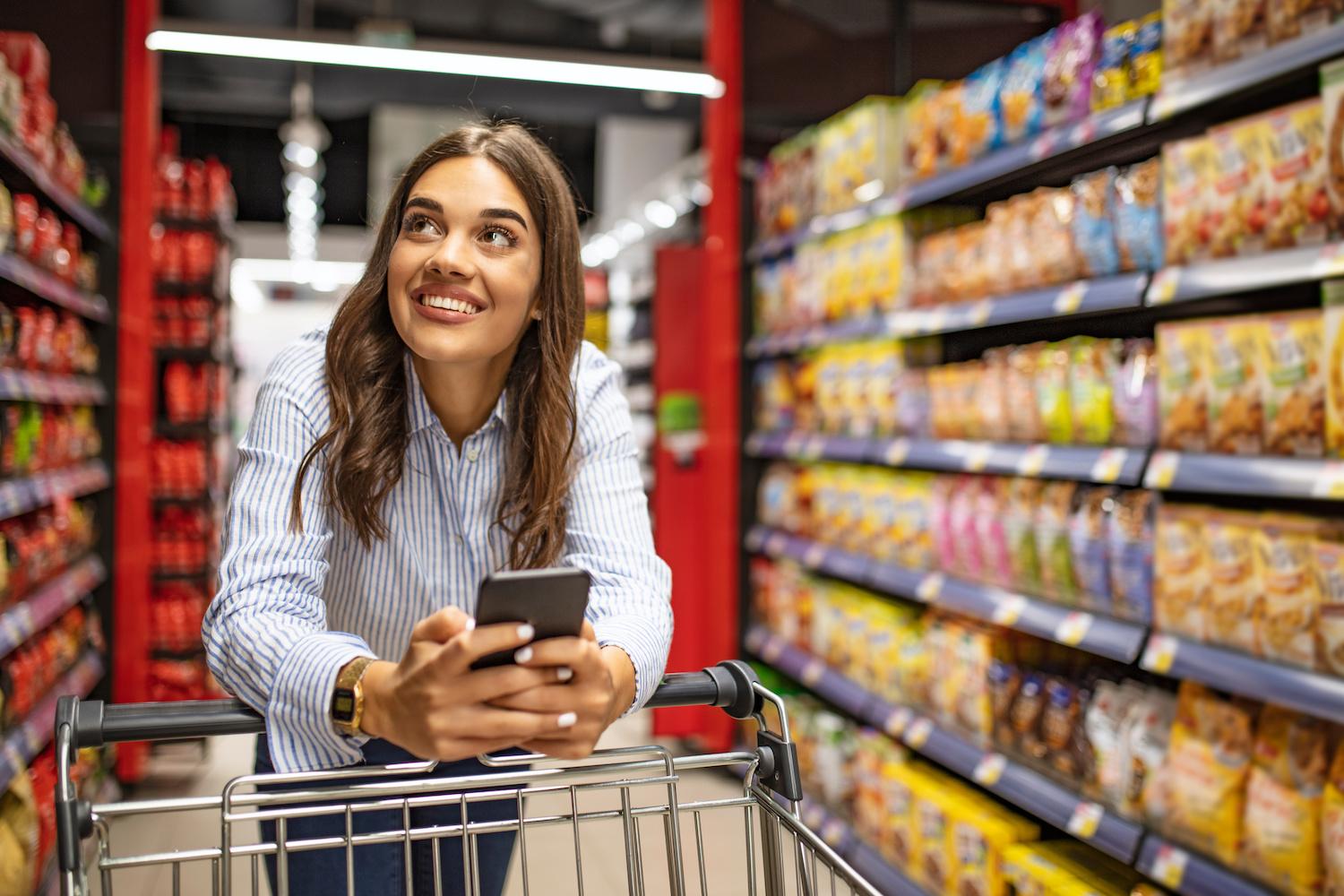 Woman shopping in grocery store - consumer trends consumer perception