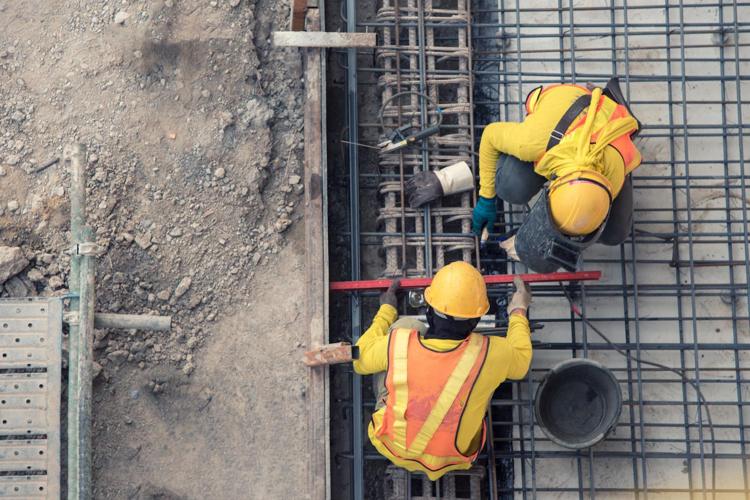 aerial view of construction workers working — how the construction sector is embracing ESG