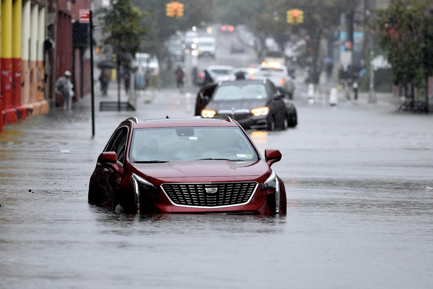 cars stuck in New York City flooding - natural disasters