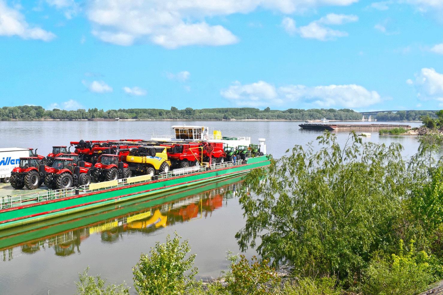 heavy logistics - shipping combine harvesters by barge