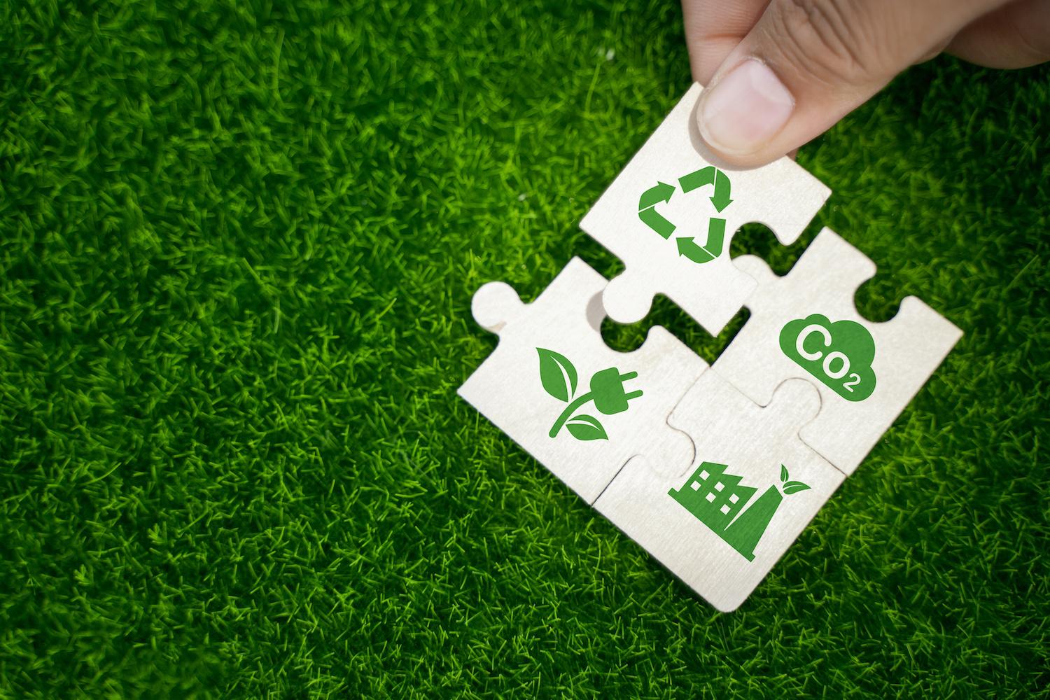 puzzle pieces representing ESG and sustainability - recycling reducing emissions