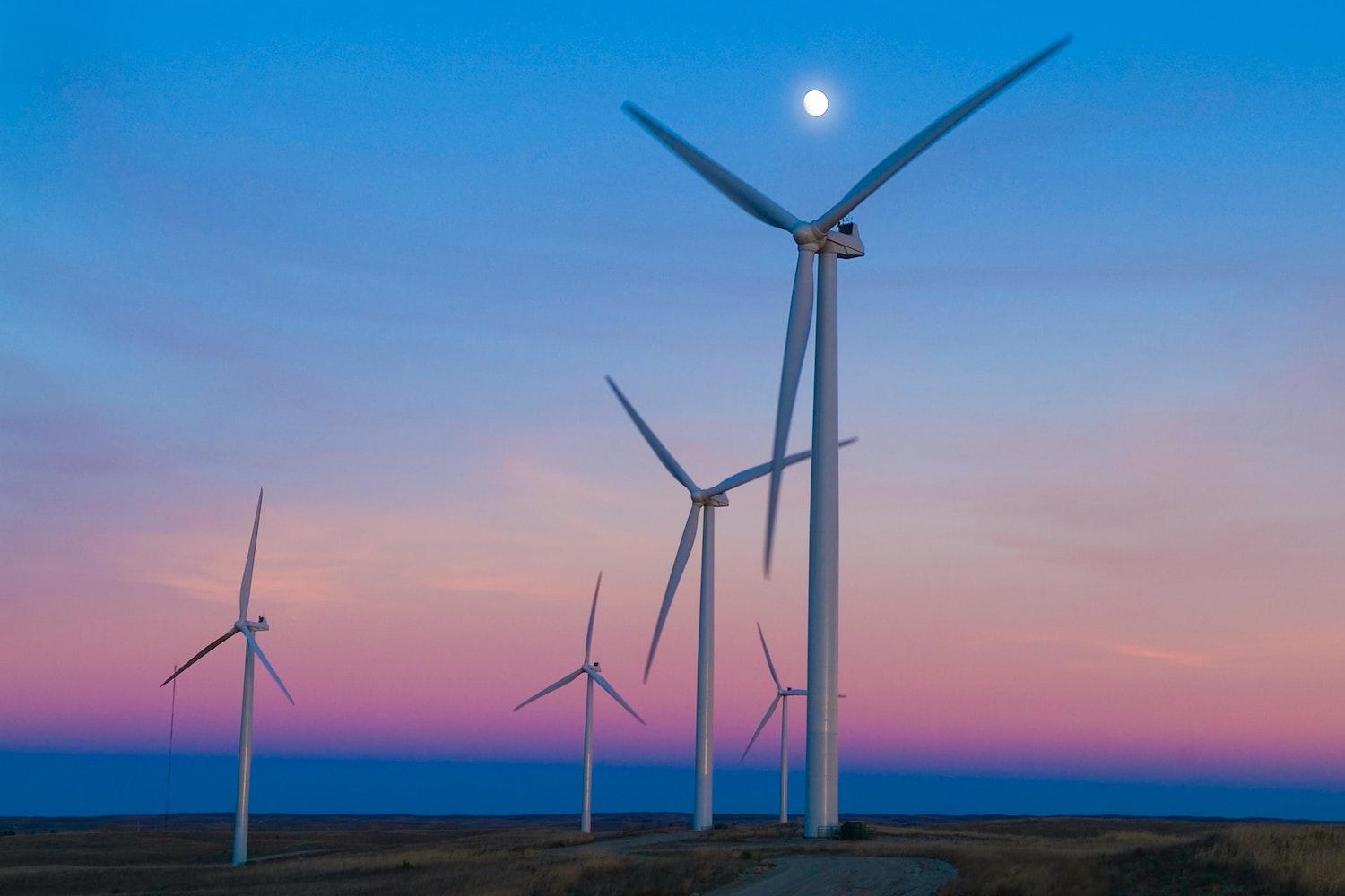 wind farm in nebraska at sunset - clean power