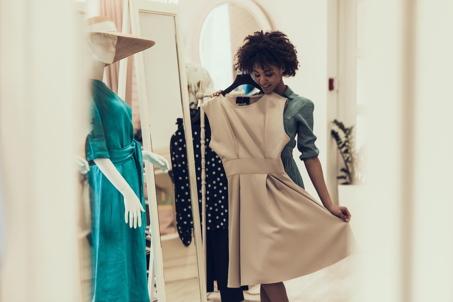 young woman shopping in boutique - Allies Should Speak Up When Black Customers Are Underserved