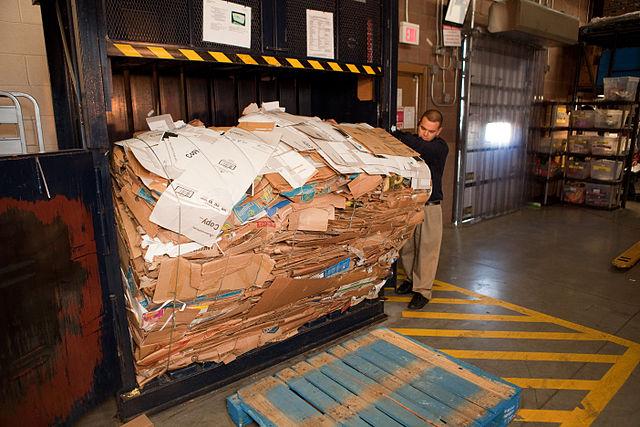 640px-Removing_box_bale_from_machine_in_Walmart_back_room.jpg