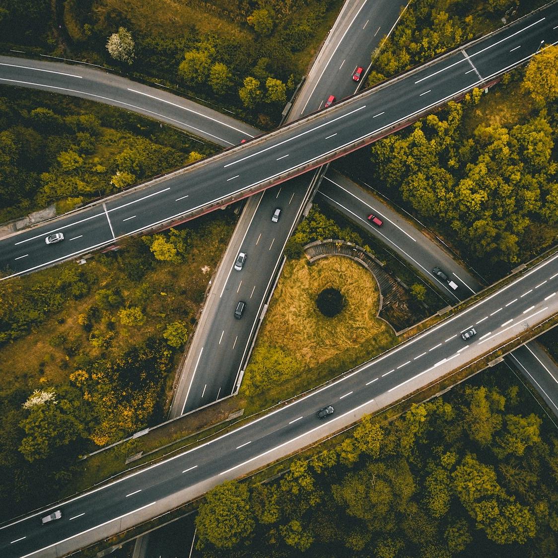 Aerial shot highway overpasses cars driving.jpg 