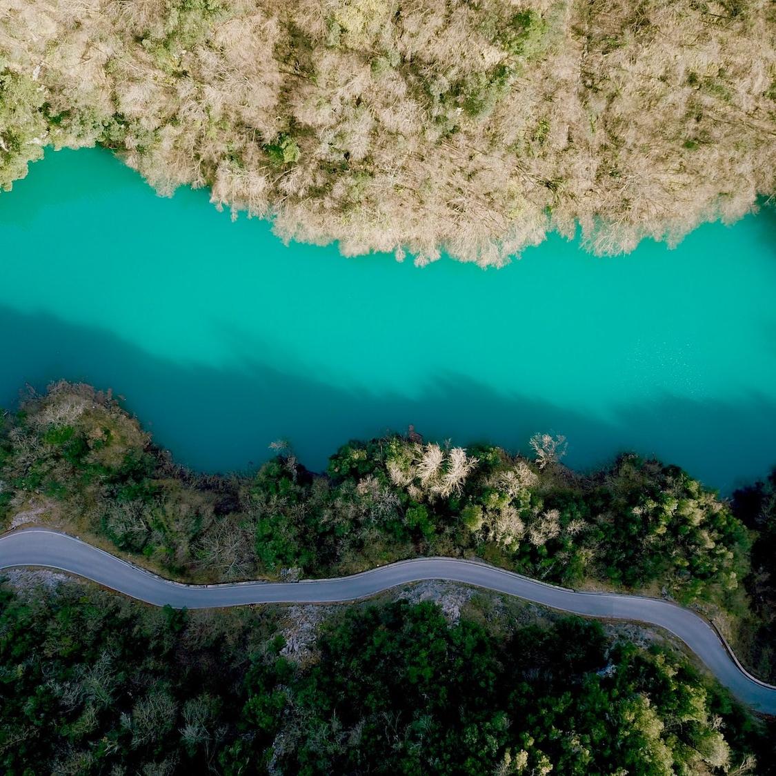 Water - Aerial shot of river forest and rural highway