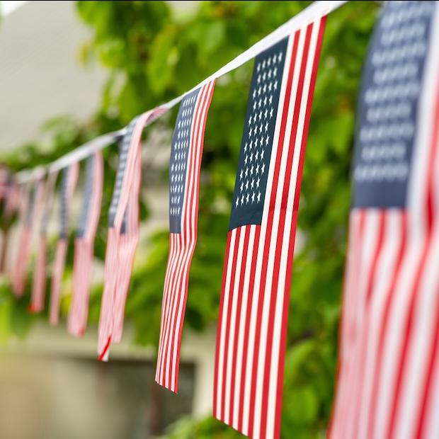 American flag bunting hanging in a yard for the Fourth of July — how employee-owned companies embrace independence