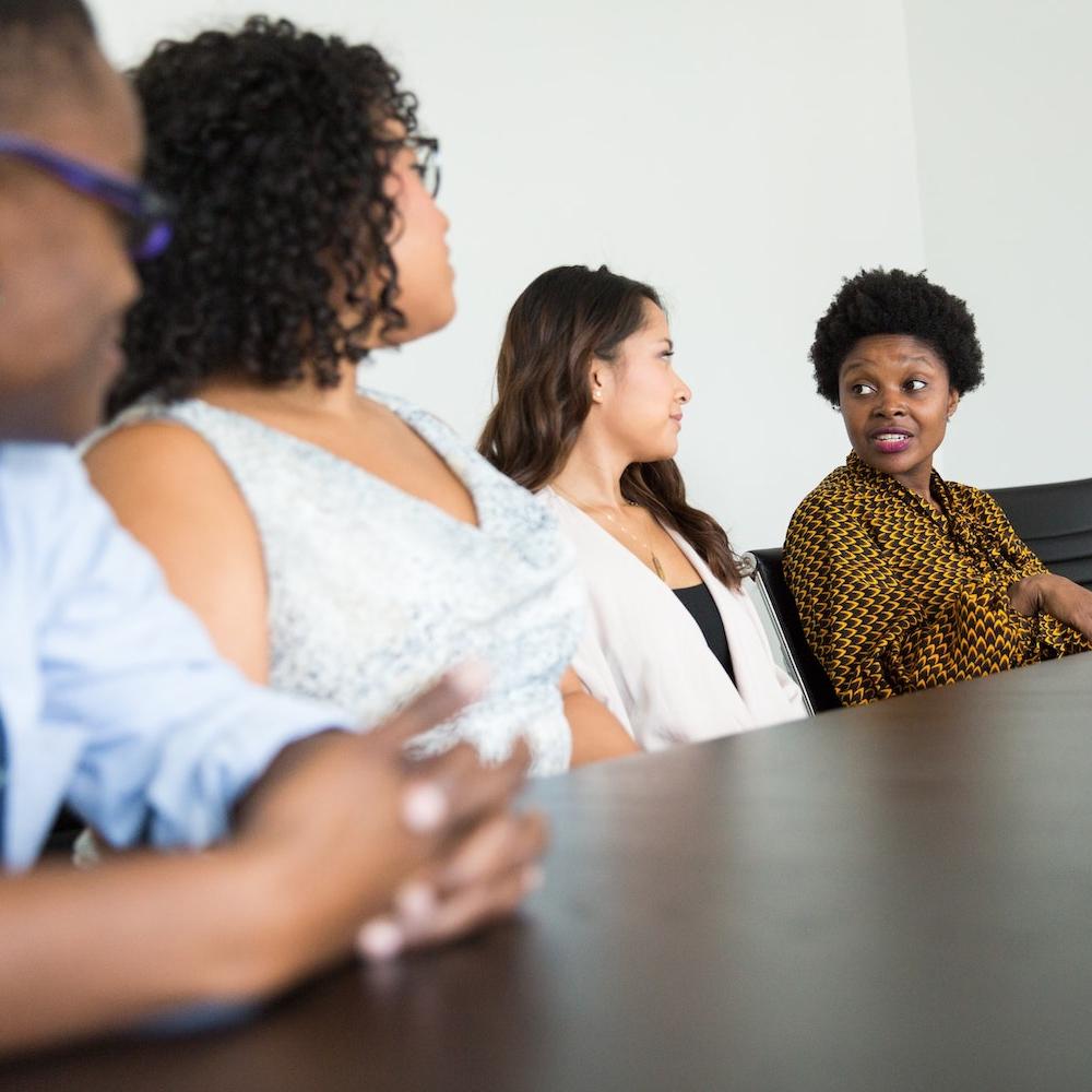 Coworkers meeting - total rewards strategy and diverse workforce