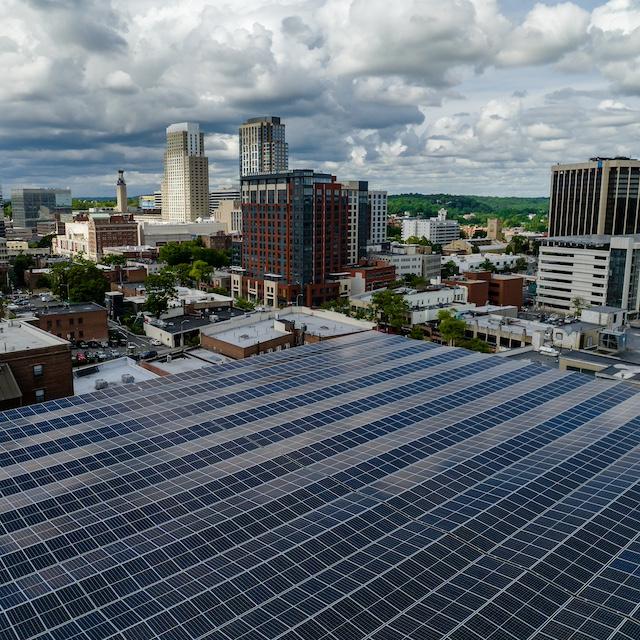 Solar panels on a building in a city — green skills