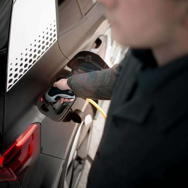A person charging an EV — Lithium-ion