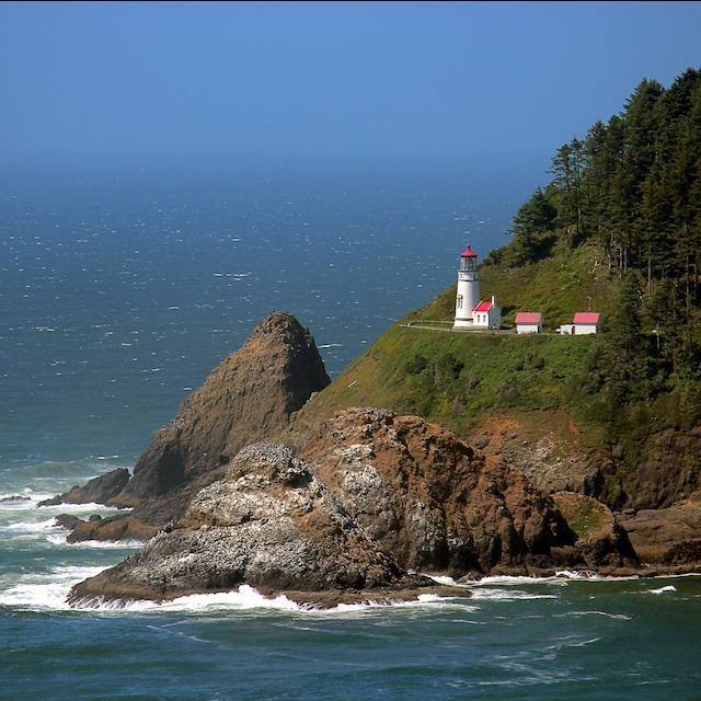 A red and white lighthouse near the Pacific Ocean — ocean protection