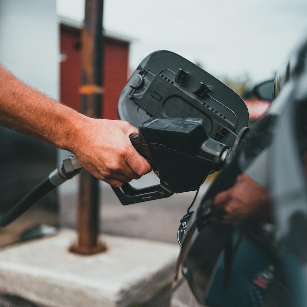 Person Pumping Gas - Gas Station