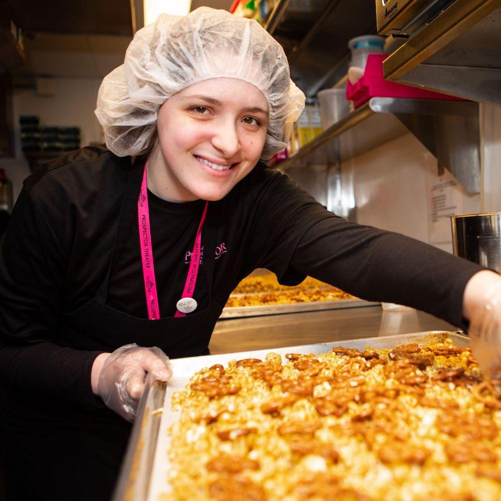 A Prospector Popcorn employee makes one of their gourmet popcorn recipes.  