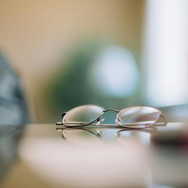Reading glasses on a table — VisionSpring