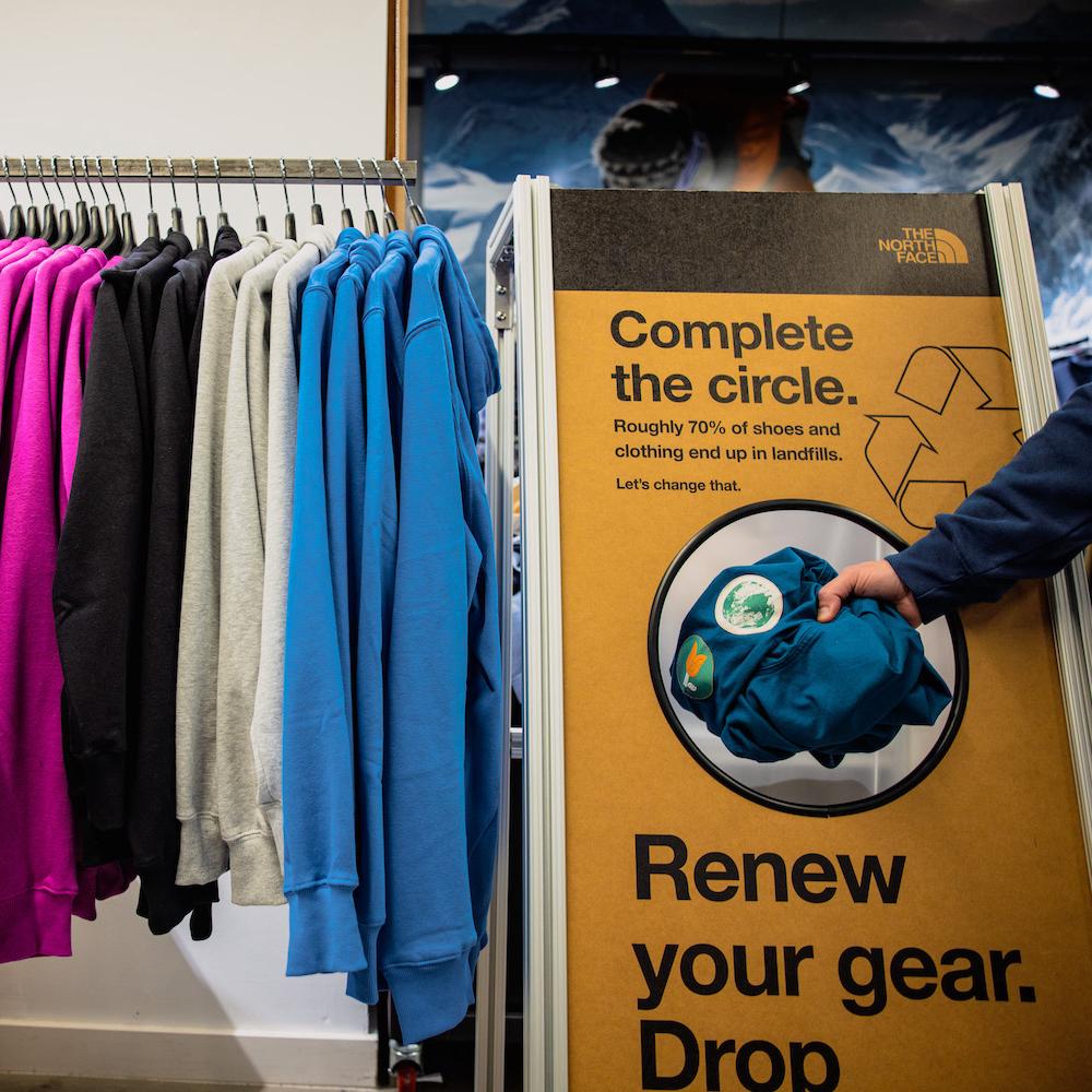 A bin at a retail location where The North Face customers can return their used gear to be refurbished or recycled - circular design and reuse in apparel