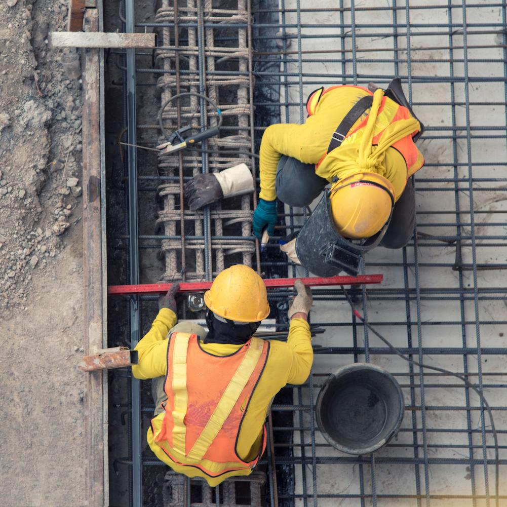 aerial view of construction workers working — how the construction sector is embracing ESG