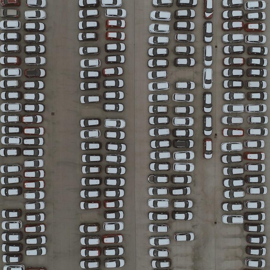 aerial view of parking lot - cars EVs
