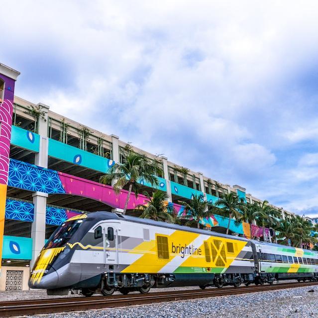 A Brightline train on the tracks. 