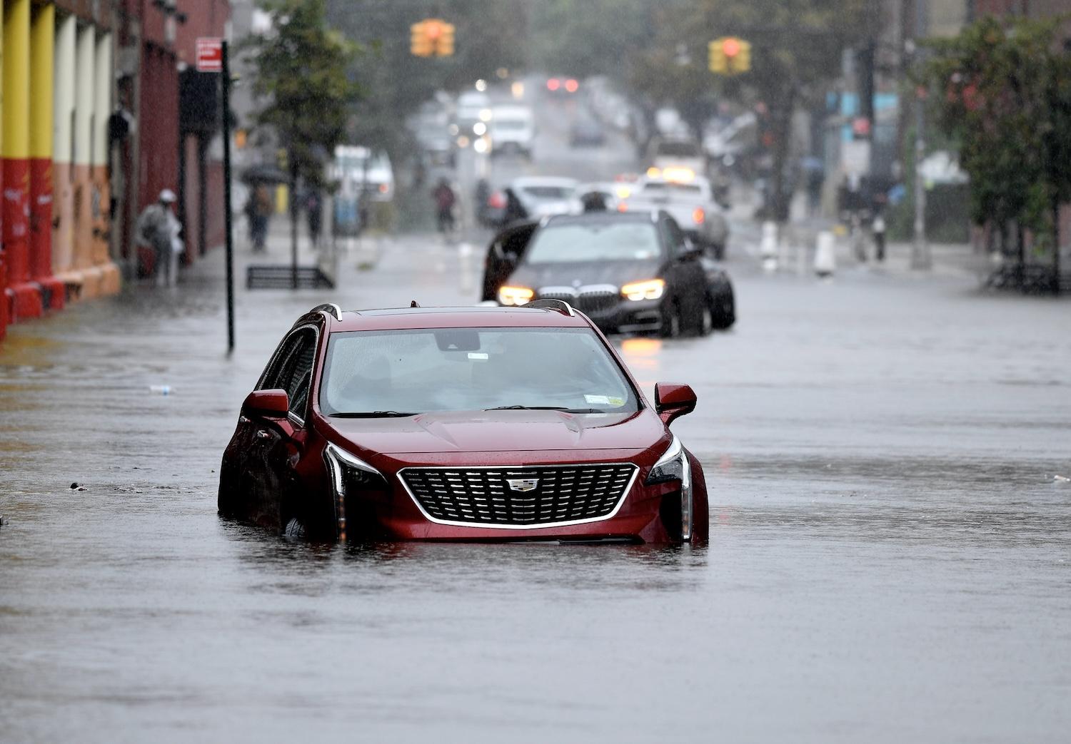 cars stuck in New York City flooding - natural disasters