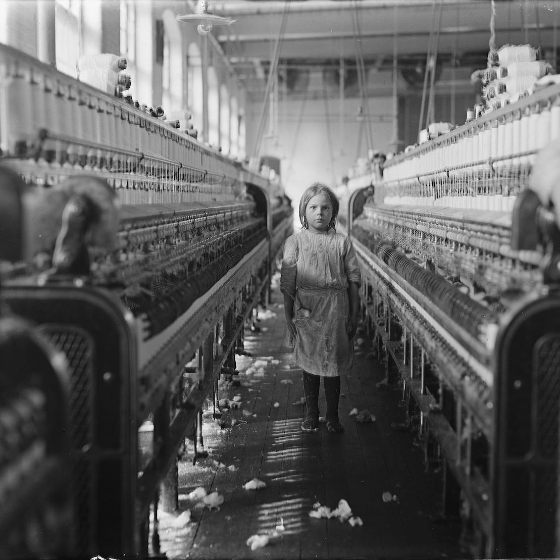 child labor in the early 20th century - little girl working in a mill