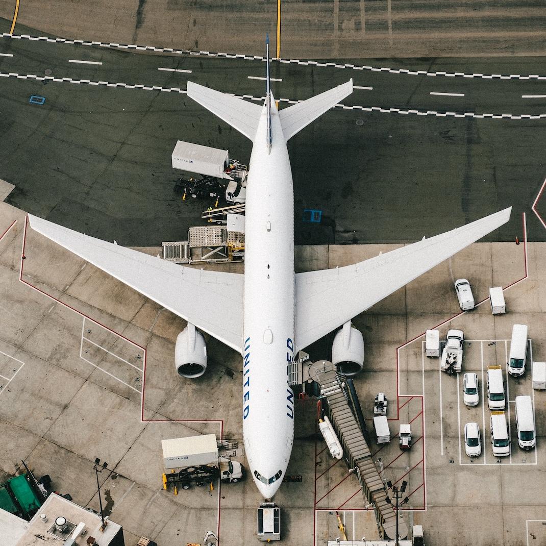 A plane parked on the tarmac at an airport. 
