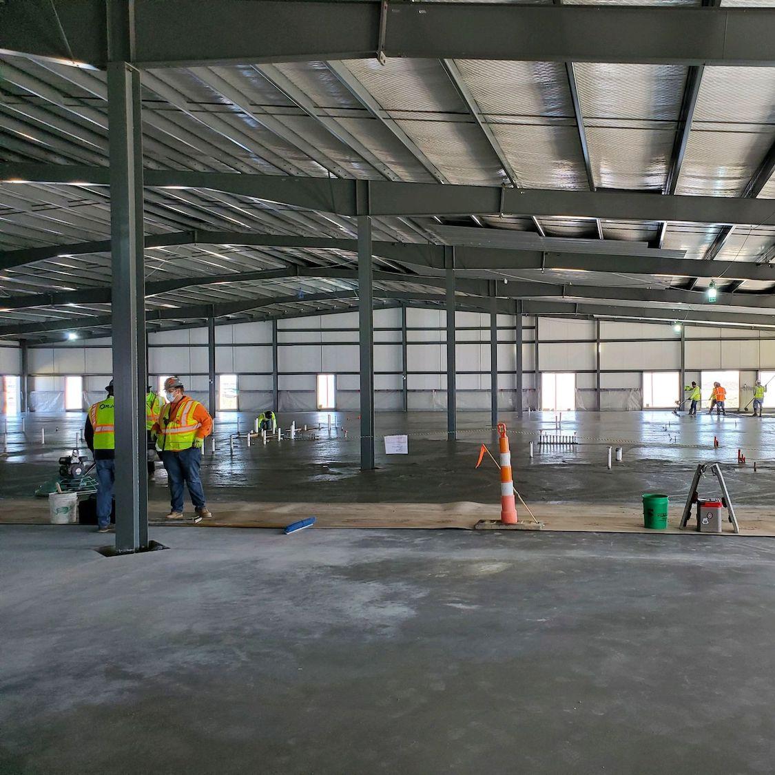 contractors lay low-carbon concrete at Meta data center - sustainability pilot program