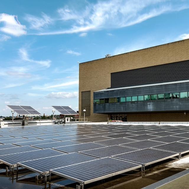 Solar panels near a building at the New Jersey Institute of Technology — decarbonization