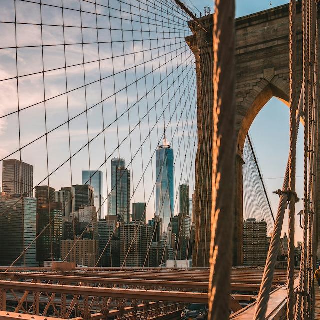 The Brooklyn Bridge during golden hour with the New York City skyline behind it — embodied carbon