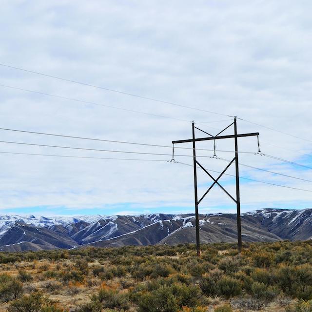 Power lines in front of mountains — electricity demand